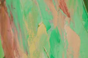 Multicolored texture painting. Abstract art background. oil on canvas. Rough brushstrokes of paint. Closeup of a painting by oil and palette knife. Highly-textured, high quality details. photo