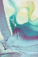Abstract created using the technique of liquid acrylic. Macro photography of the smallest details of a picture. The picture shows how overflows of shades and colors of paint resemble space motifs. photo