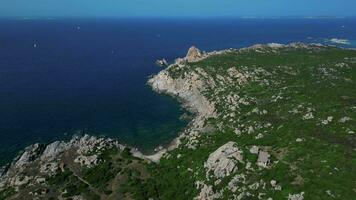 Aerial orbiting view of cliff and sea in Sardinia video