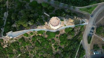 Aerial backward top down view of tower in Santa Teresa city in Sardinia video