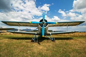 Stored classic small plane. Old timer general aircraft at museum. Aviation and travel. Aerospace industry. photo