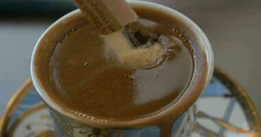 Putting brown sugar into coffee video