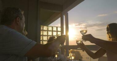 People toasting during dinner on the balcony video