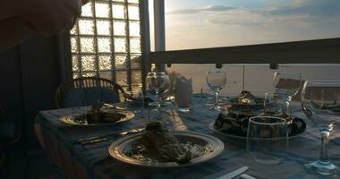 Girl making photo of served dinner with cellphone video