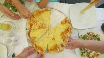 Family taking delicious cheese pizza video