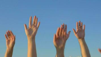 Hands up on blue sky background video