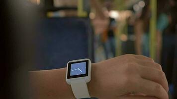 Woman using smartwatch in the bus video