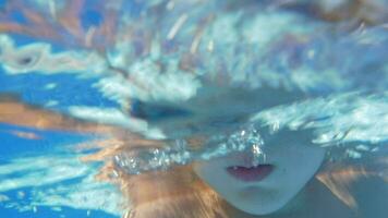 Underwater swimming of a child in goggles video