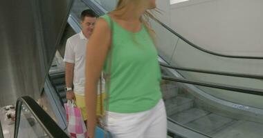 Smiling Family on the Escalator after Shopping video