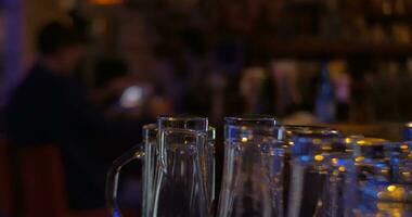 Glassware and man with pad in cafe video