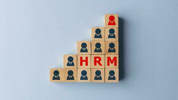 HRM - Human resource management and recruitment concept on wooden cubes. Human resource and talent management for recruitment business concept. photo