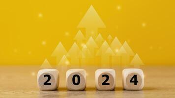 2024 goals of business or life. Wooden cubes with 2024 icon. Starting to new year. Business common goals for planning new projects, annual plans, business target achievement photo