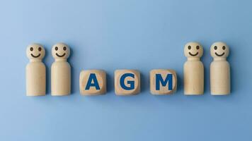 Conceptual image of a group of people with the word AGM. business concept. AGM annual general meeting photo