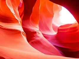 Eroded sandstone and ray of sunlight in Antelope Canyon photo