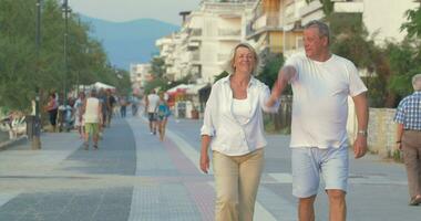 Couple having enjoyable walk on summer resort video