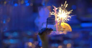 Bar cocktails with sparkler and Greek flag video