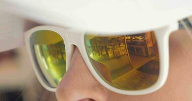 close up of woman wearing mirrored sunglasses video