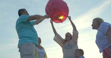 Big family launching sky lantern video