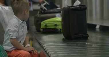 Little child at baggage claim area video