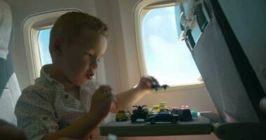 Child playing with toys during the flight video