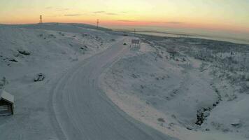 Aerial view of car driving snowy road and drifting video