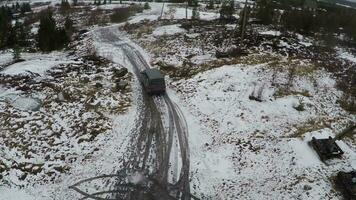 Car driving in northern town, aerial view video