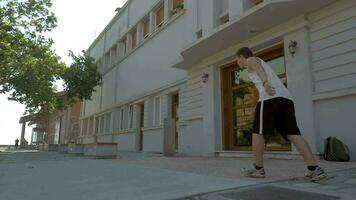 Teenager performing parkour in the street video