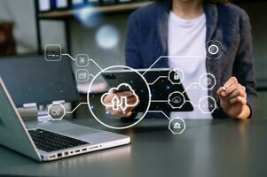 Woman use Laptop computer and tablet with cloud computing diagram show on hand. Cloud technology. Data storage. Networking and internet service concept. with virtual icon photo