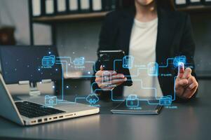 Blockchain financial technology to secure cryptocurrencies for online payment and digital transaction. Fintech concept. Man working on laptop computer, smartphone and tablet. with virtual icon photo