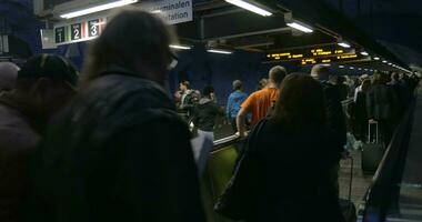 Crowd of people on flat escalators in subway video