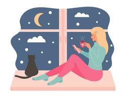 Young blonde woman sitting on the window with a mug of hot drink and using smartphone. Black cat sitting and looking out the window. Snowy night weather outside the window. vector