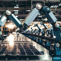 Industrial robot arms are producing solar panels in large factories. photo