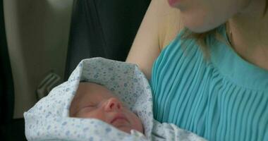 New born baby sleeping in mothers hands video