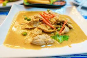 Pork Panang Curry with Coconut milk, Red savory curry paste with pork,Traditional and Famous Street food in Thailand photo