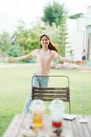 Happy woman with Dessert in cafe, young Asian girl smiling during eating cake and drinking ice beverage at home photo