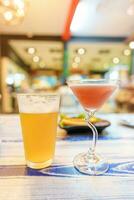 Draft Beer and Cocktail glass on table. Oktoberfest, Party and celebration concept photo