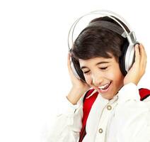 Pretty teen boy enjoying music photo