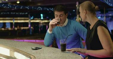 Young people talking and having drinks in the bar video