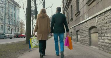 Couple enjoying the walk after good shopping video