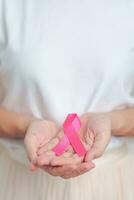 Pink October Breast Cancer Awareness month, woman with pink Ribbon in hospital for support people life and illness. National cancer survivors month, Mother and World cancer day concept photo