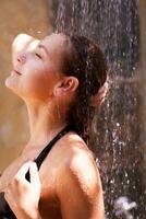 Woman relaxed in the shower photo