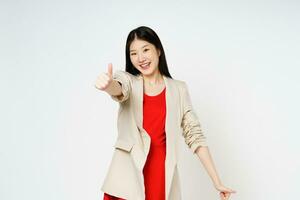 Young  woman showing thumbs up isolated on white background. photo