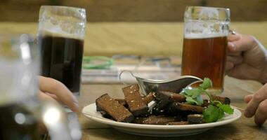 Beer and toasts with cream sauce in cafe video