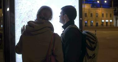 Tourists checking the pad route with street map video