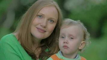 Outdoor portrait of happy mother and little son video