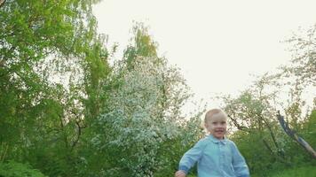 Happy child running on the path in park video