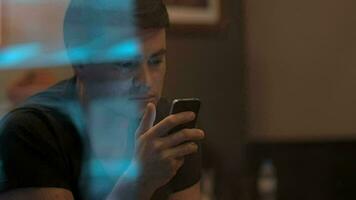 Man Using Smartphone in Cafe video