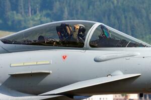 Military fighter jet plane at air base. Airport and airfield. Air force flight operation. Aviation and aircraft. Air defense. Military industry. Fly and flying. photo