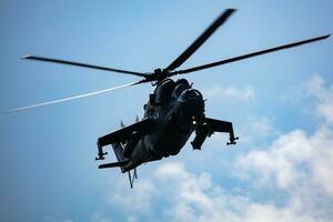 Untitled military helicopter at air base. Air force and army flight transportation. Aviation and rotorcraft. Transport and airlift. Military industry. photo