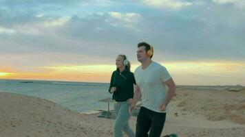 Evening run together on the sea shore video
